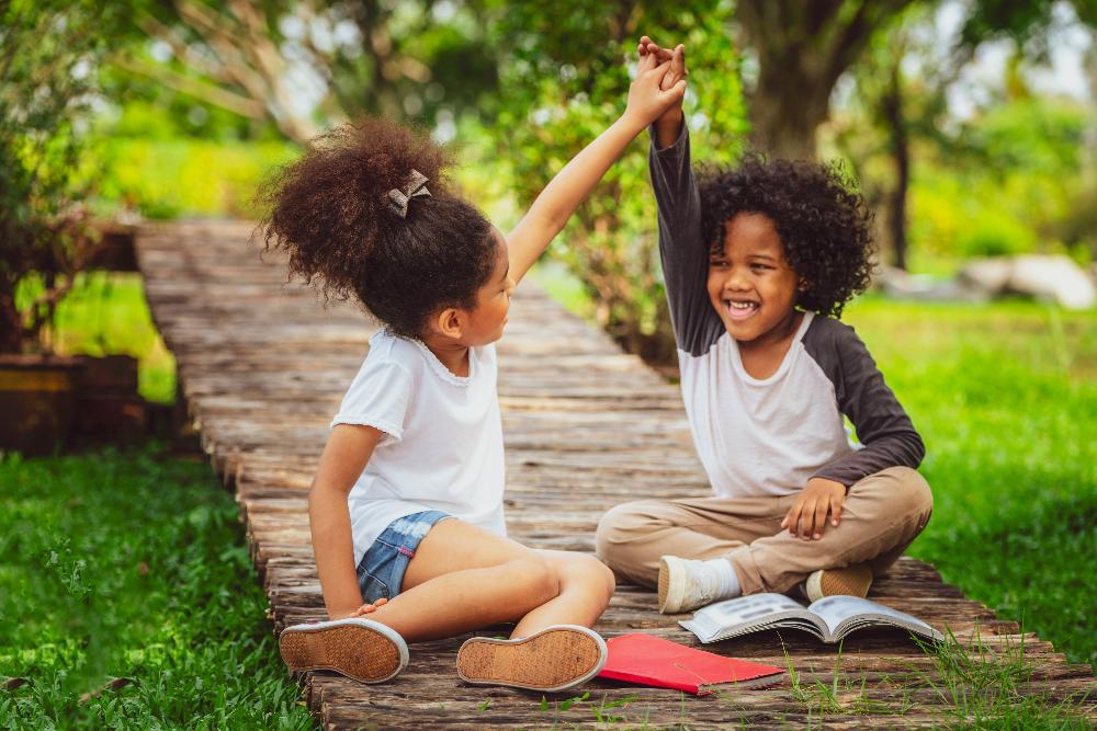 two children playing outside | childrens dentist reservoir