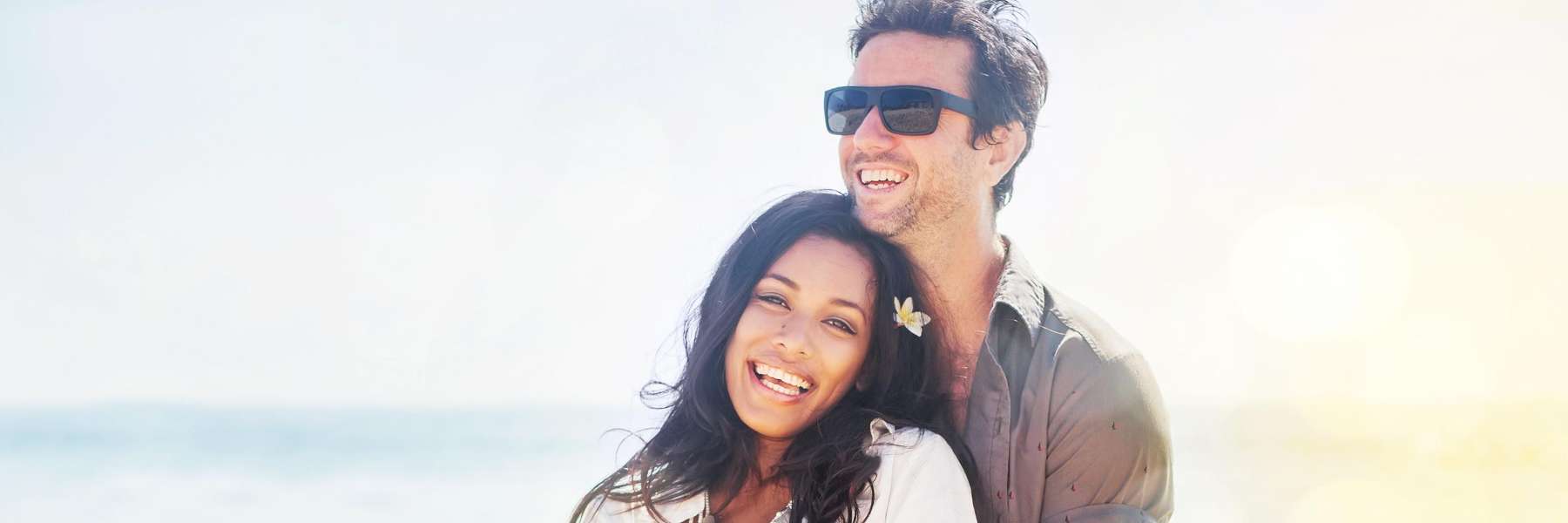 young couple on beach | cosmetic dentist reservoir