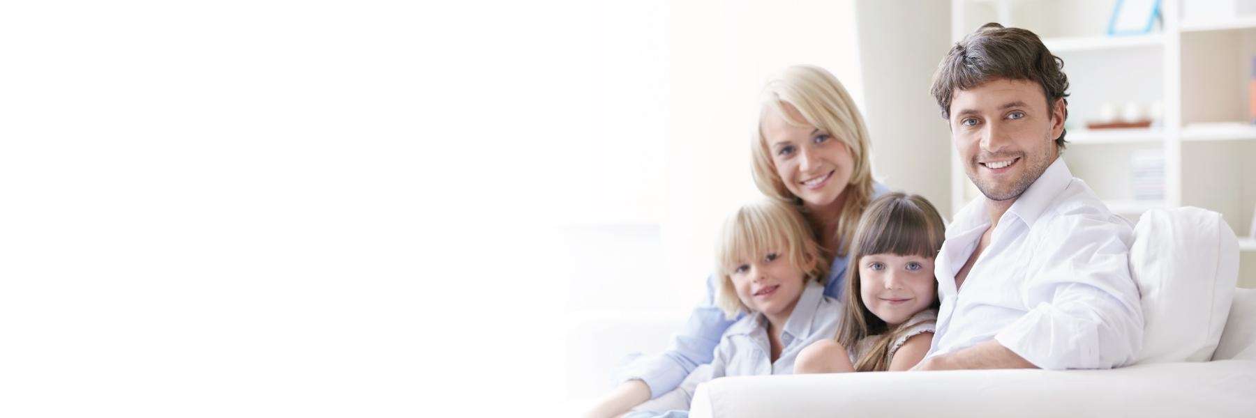 family of four hugging | dentist reservoir
