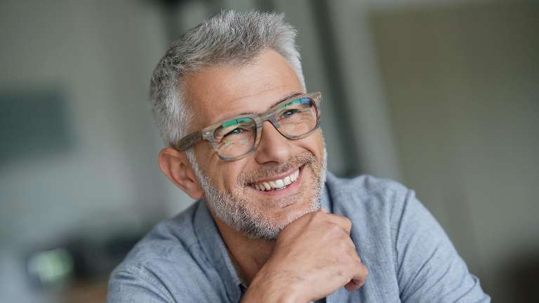 man in glasses smiling | preventative dentistry reservoir 