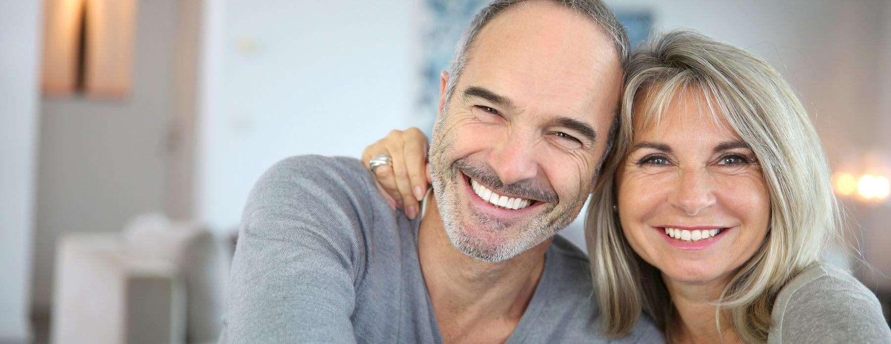 Couple smiling | Reservoir Dental Implants