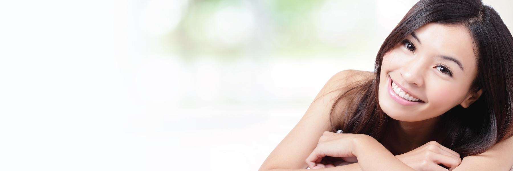 woman with black hair smiling | dentist reservoir vic